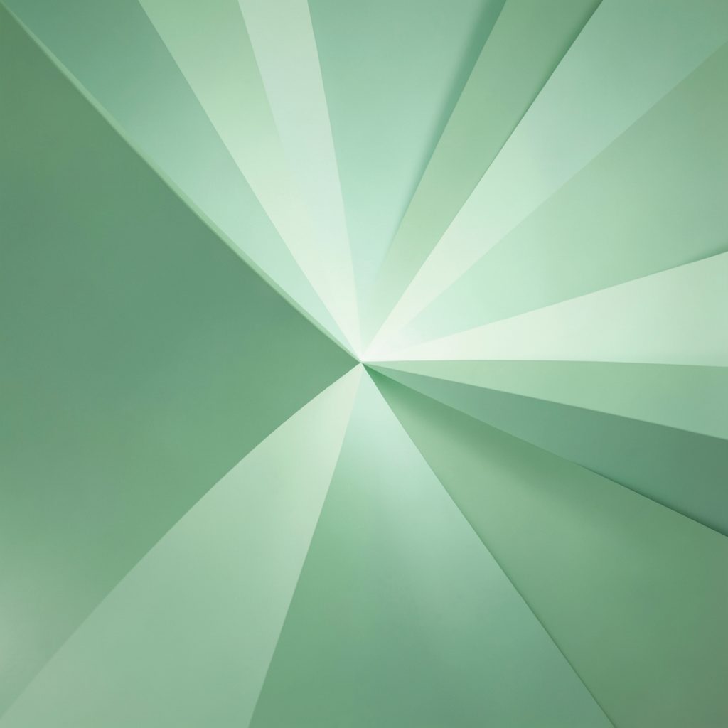 Abstract geometric shapes in soft green tones radiating from the corner, suggesting energy and movement